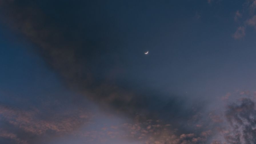 Moon at a cloudy sky HD Wallpaper