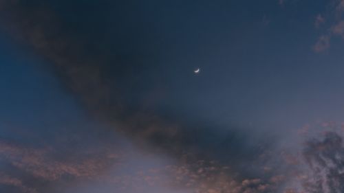 Moon at a cloudy sky HD Wallpaper
