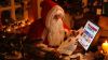 Santa Claus surfing on the Internet HD Wallpaper