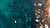 Aerial view of stones in the water HD Wallpaper
