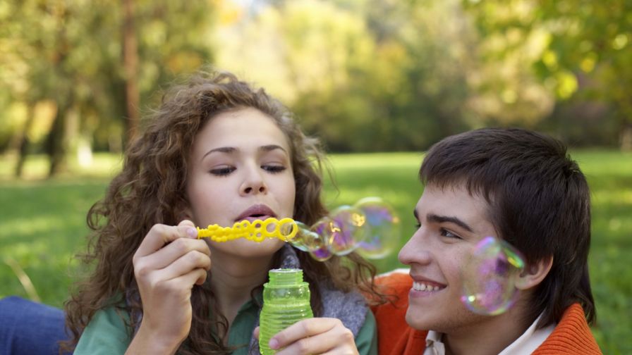 Boy and girl making bubbles HD Wallpaper