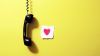 Heart next to the phone HD Wallpaper