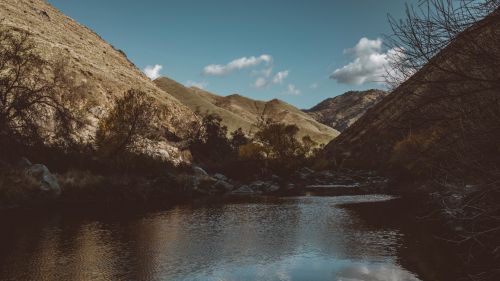 Huge stones next to lake HD Wallpaper