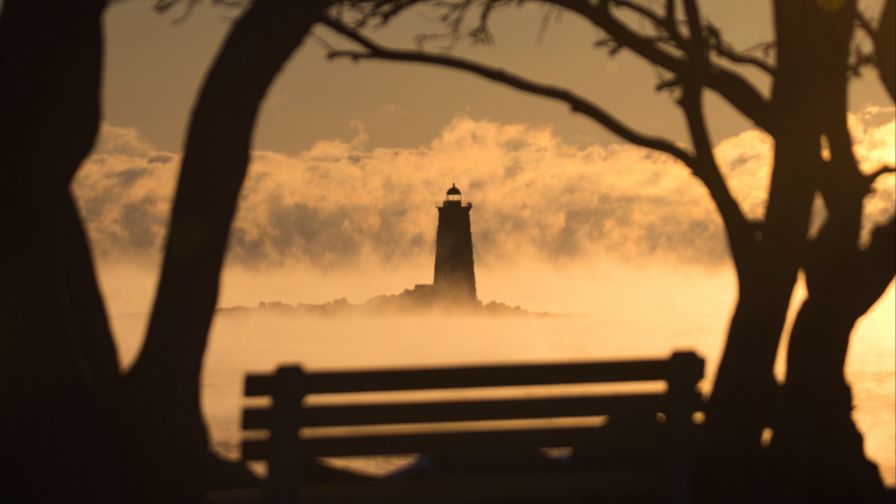 Lighthouse covered in fog HD Wallpaper