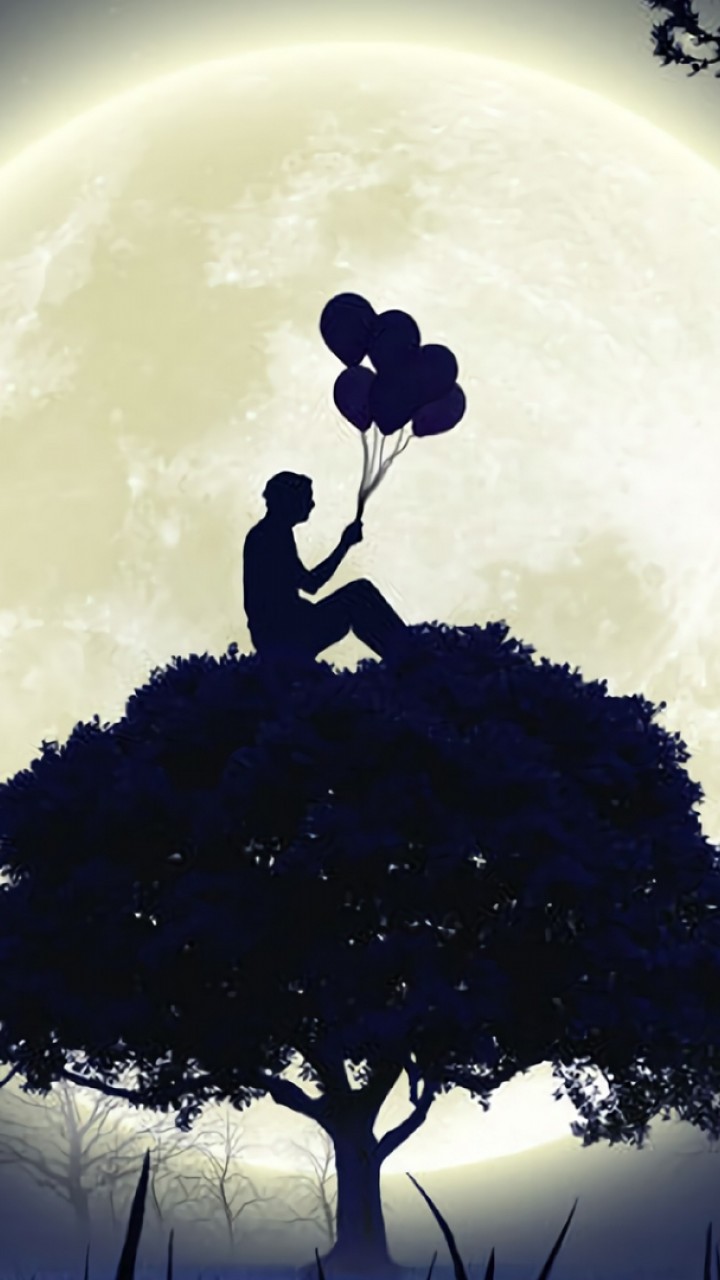 Man sitting on a tree with ballons on his hand HD Wallpaper