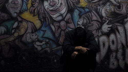 Man standing next to graffiti HD Wallpaper