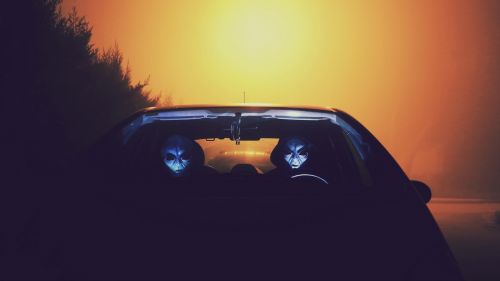 People wearink alien masks inside a car HD Wallpaper
