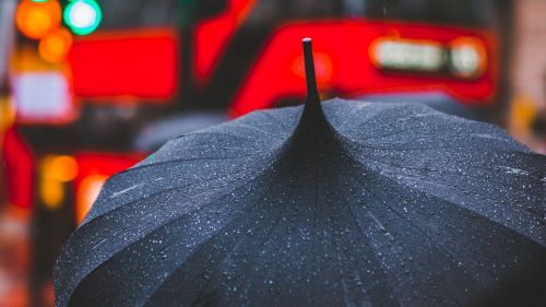 Rain drops at a black umbrella HD Wallpaper