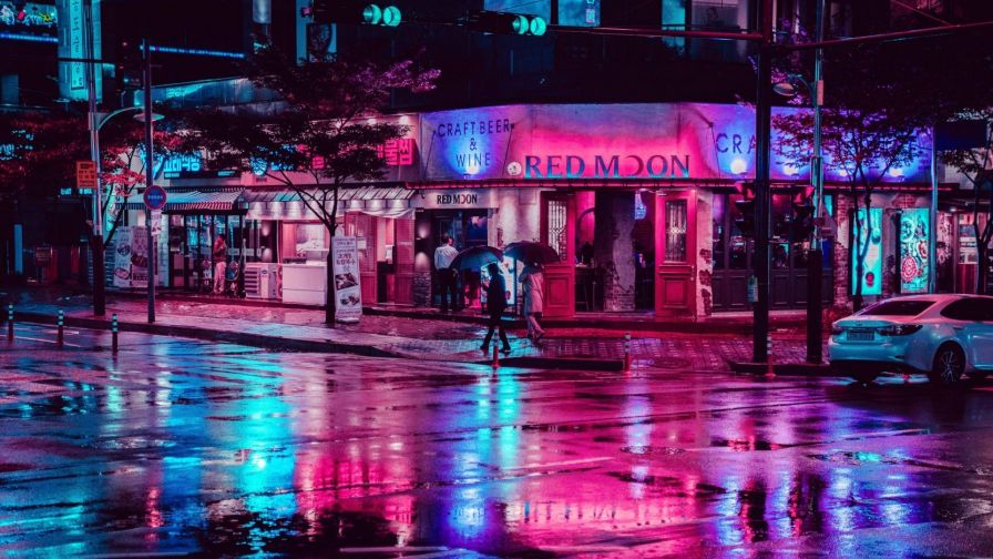 Reflection of neon lights at street HD Wallpaper