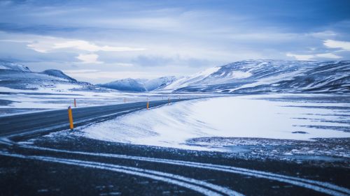 Road next to snowy mountains HD Wallpaper