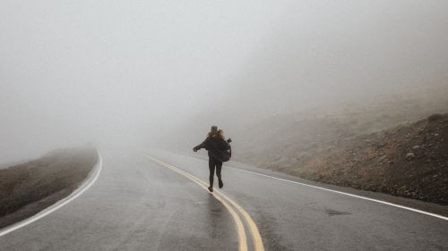 Silhouette running on a foggy road HD Wallpaper