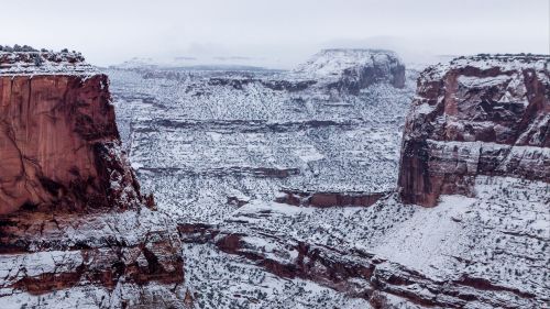 Snow over the cliff HD Wallpaper