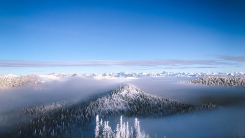 Snowy mountain under a blue sky HD Wallpaper