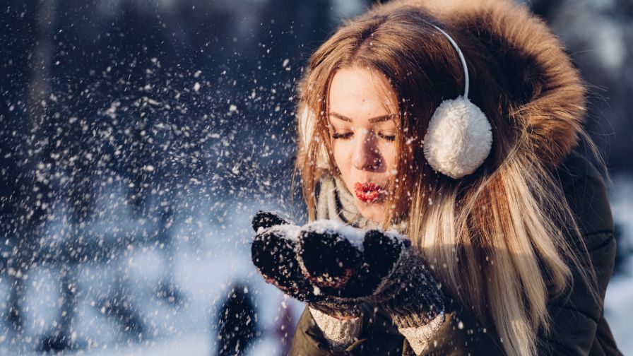 Woman Blowing Snow from Hand HD Wallpaper